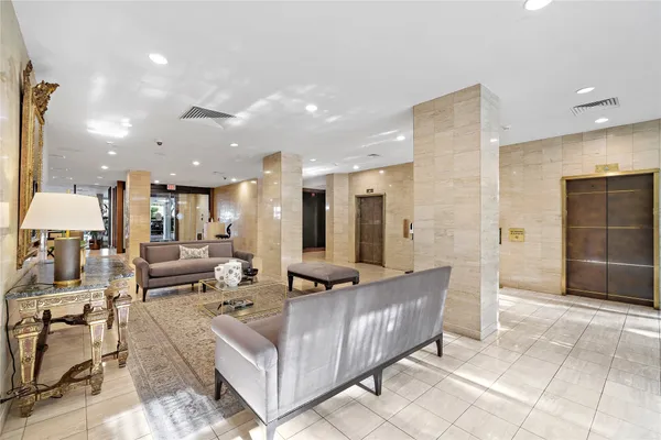 a living room with furniture and a bath tub