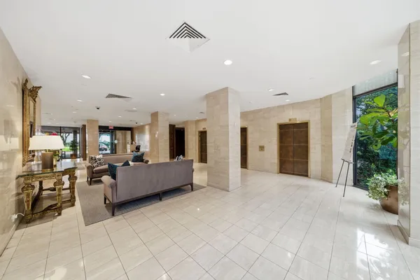 a large living room with furniture and a large window