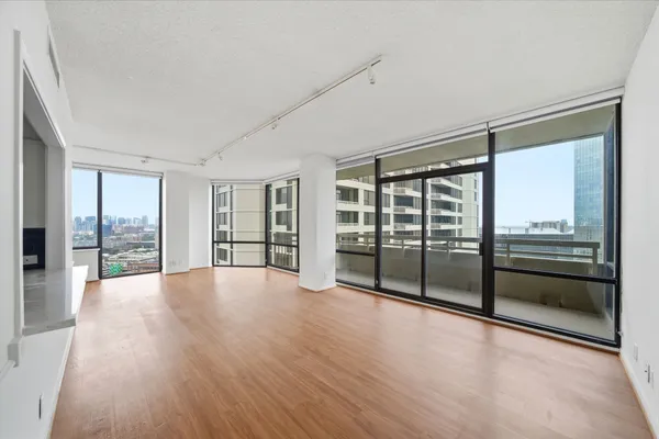 a view of an empty room with glass door