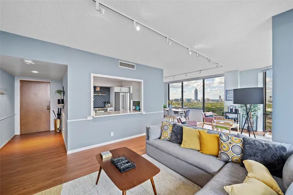 a living room with furniture and a large window