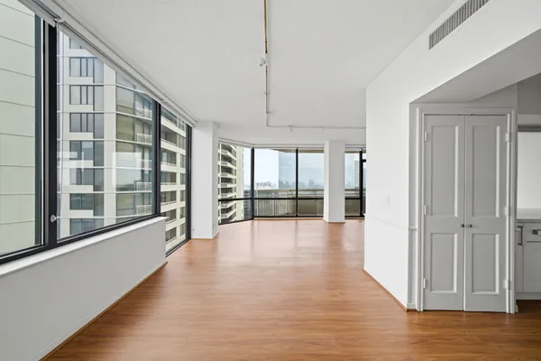 a view of an entryway with wooden floor