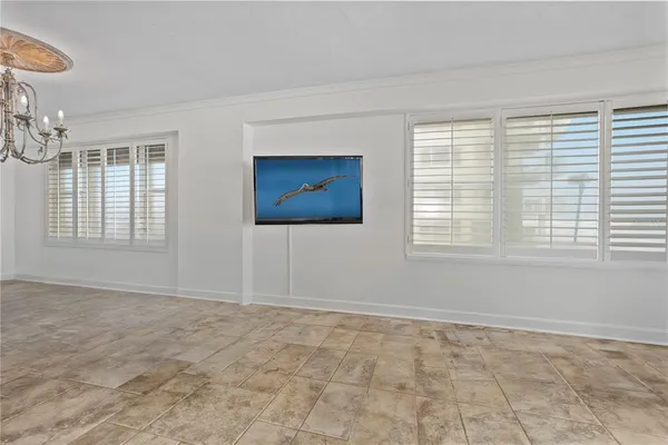 a bedroom with a bed and a ceiling fan