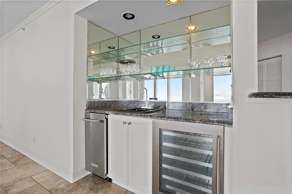 a bathroom with a sink and mirror