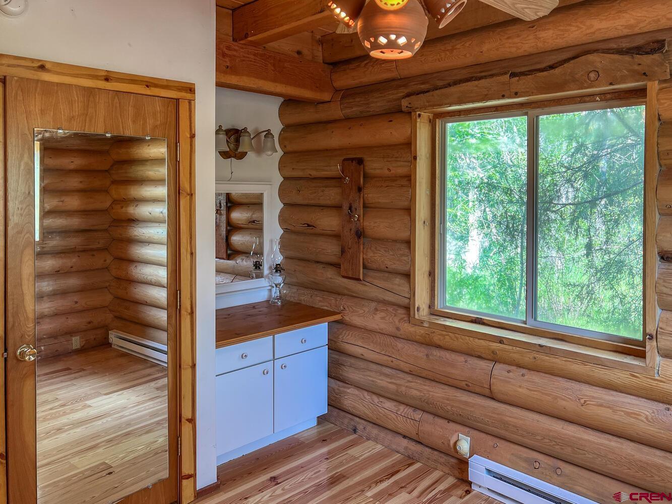 454 Estates Circle Road Pagosa Springs, CO 81147 - Photo 11 of 35 a view of walk in closet with wooden floor