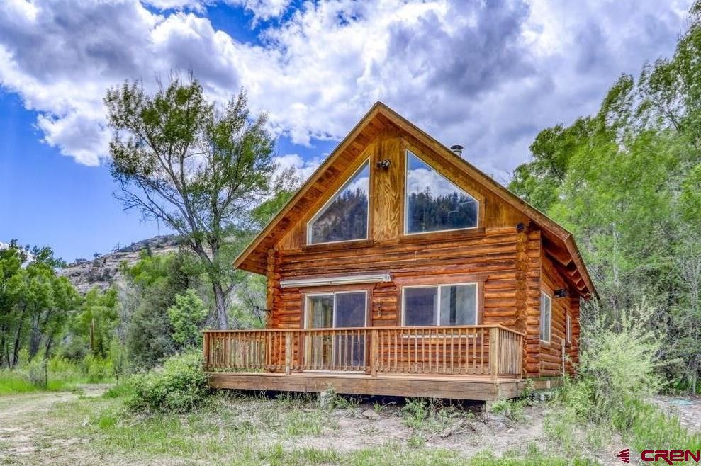 454 Estates Circle Road Pagosa Springs, CO 81147 - Photo 2 of 35 a view of a house with a yard