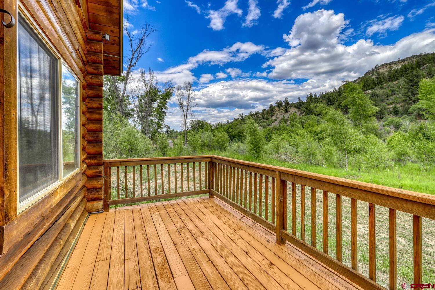 454 Estates Circle Road Pagosa Springs, CO 81147 - Photo 3 of 35 a view of balcony with wooden floor