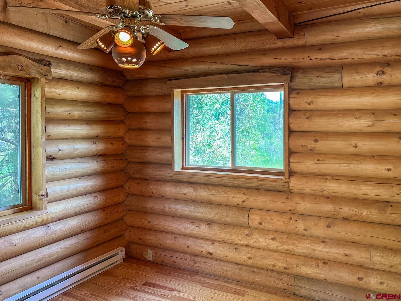 454 Estates Circle Road Pagosa Springs, CO 81147 - Photo 10 of 35 a view of entryway with a window and a chandelier