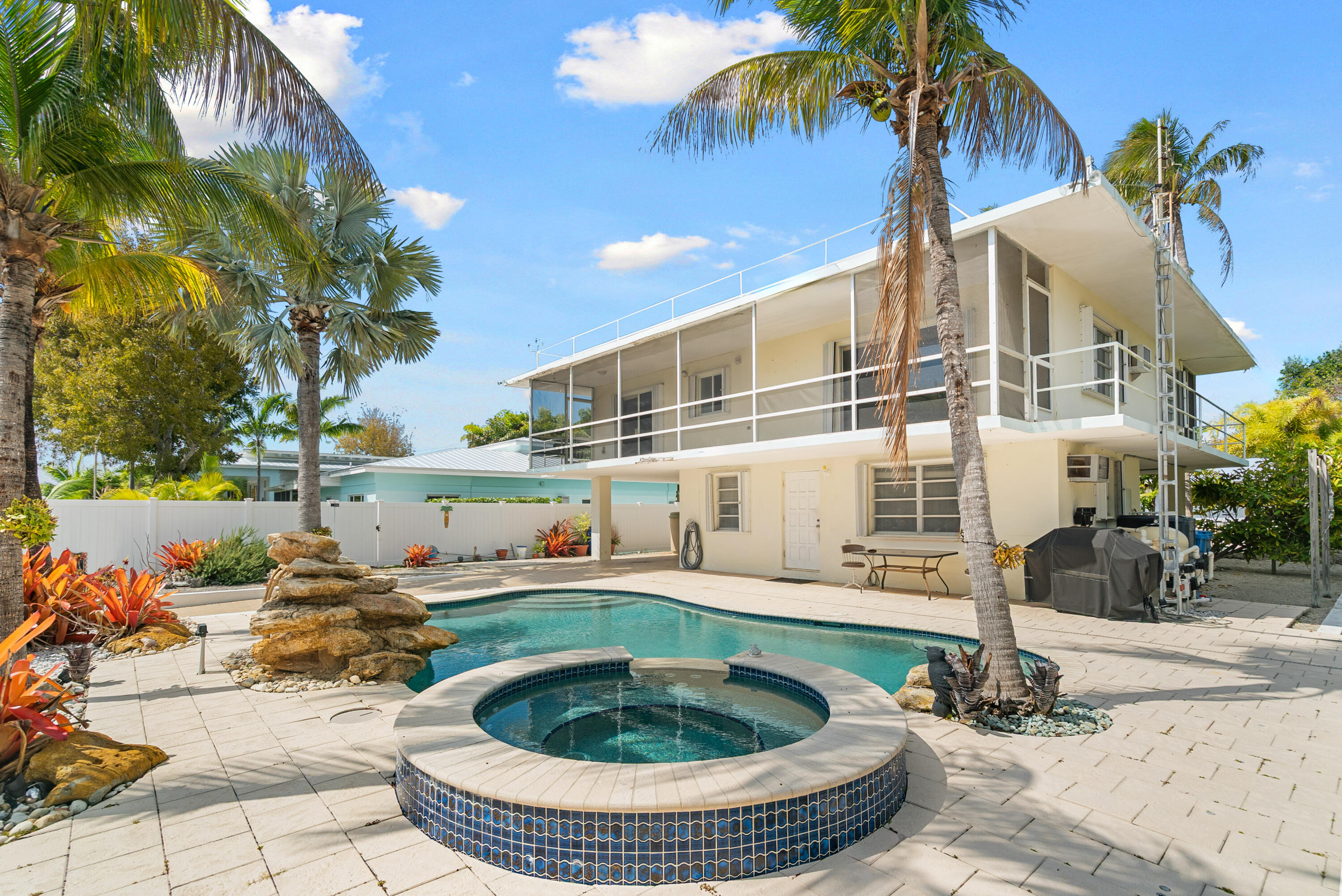 234 Mohawk Street Tavernier, FL 33070 - Photo 1 of 61 a view of a house with backyard and swimming pool