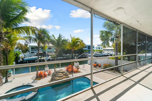 an empty room with furniture and window