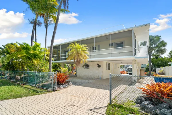 a view of a backyard with a patio