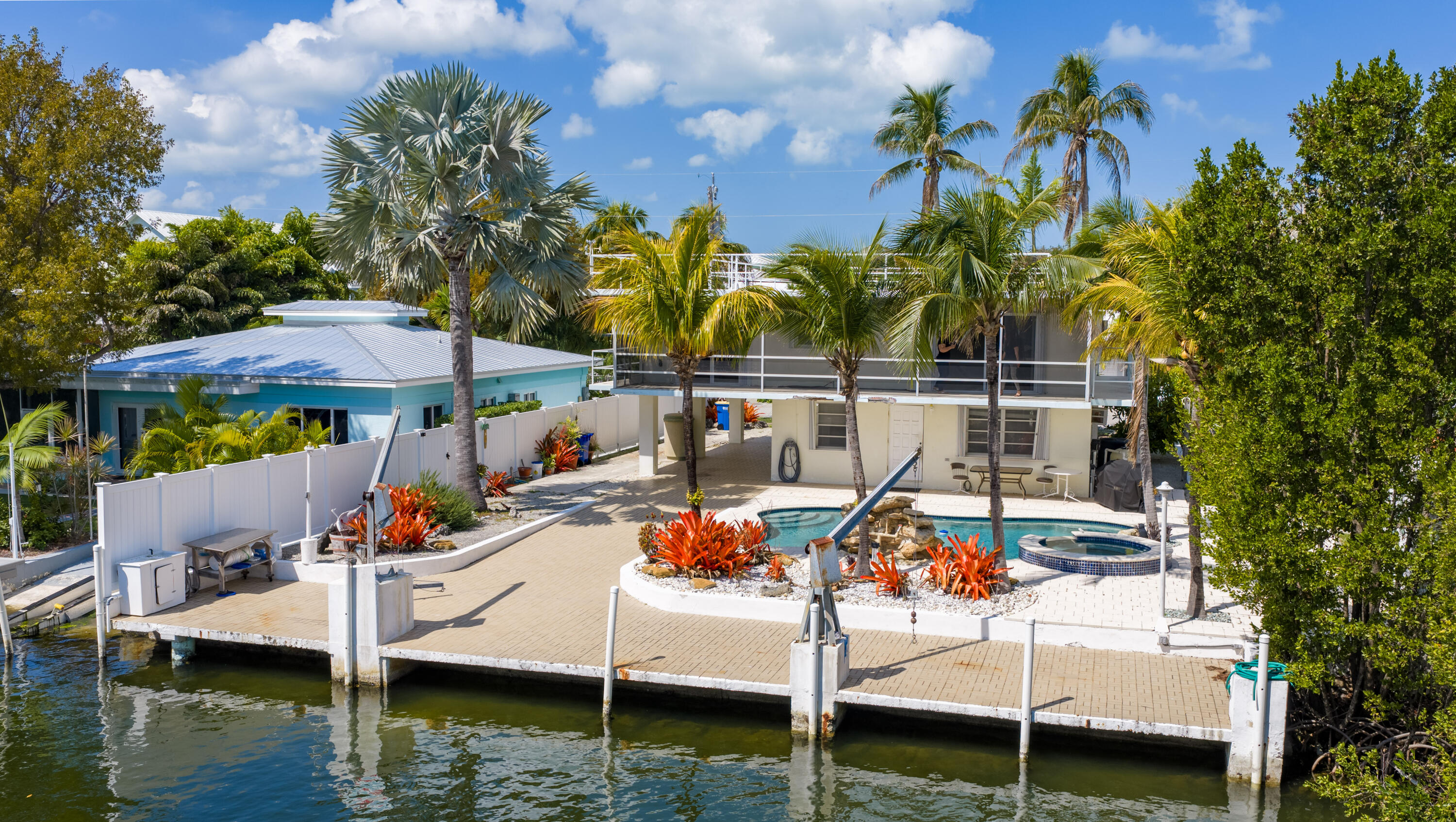 234 Mohawk Street Tavernier, FL 33070 - Photo 37 of 61 a view of a swimming pool with a patio and a yard