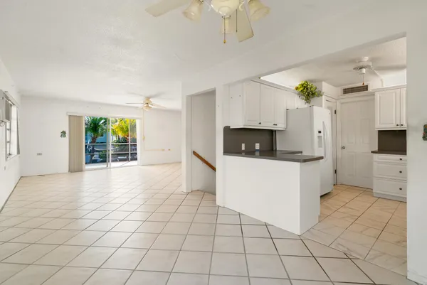 a view of a kitchen with microwave and cabinets