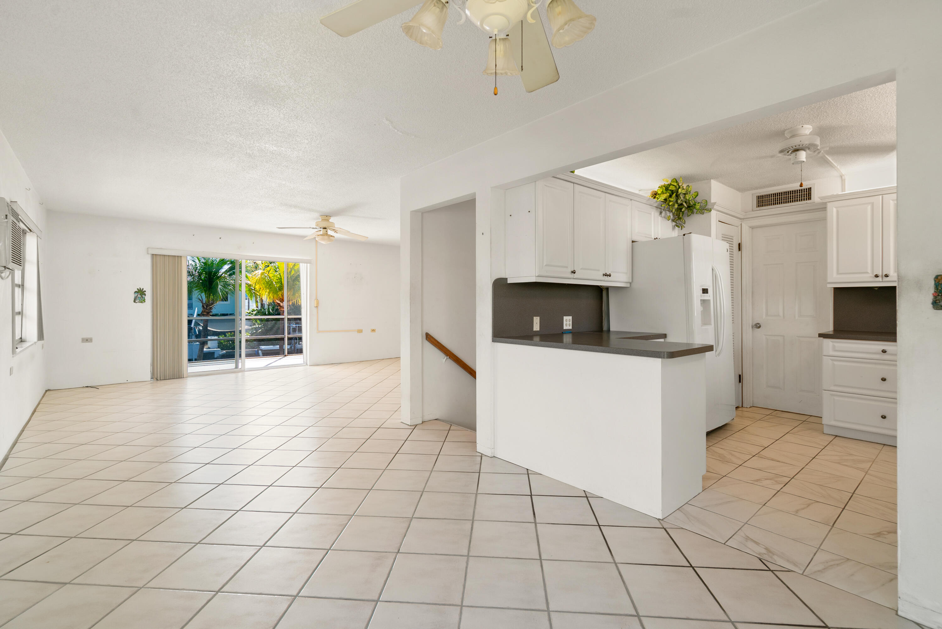 234 Mohawk Street Tavernier, FL 33070 - Photo 9 of 61 a view of a kitchen with microwave and cabinets