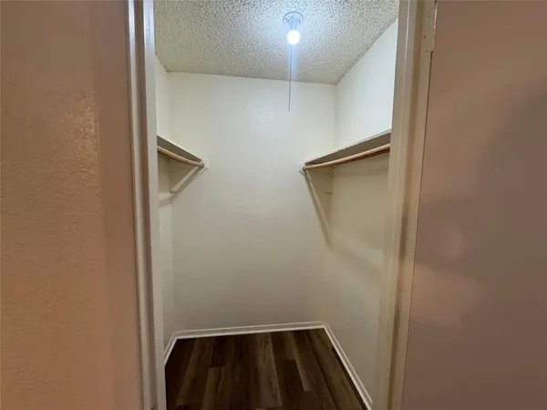 a view of wooden floor in an empty room