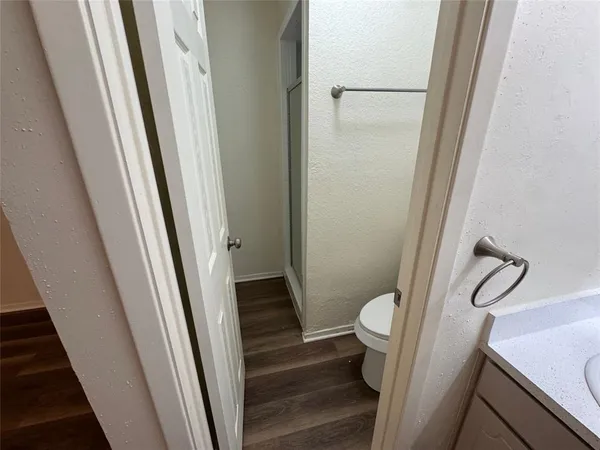 a view of room with window and hardwood floor