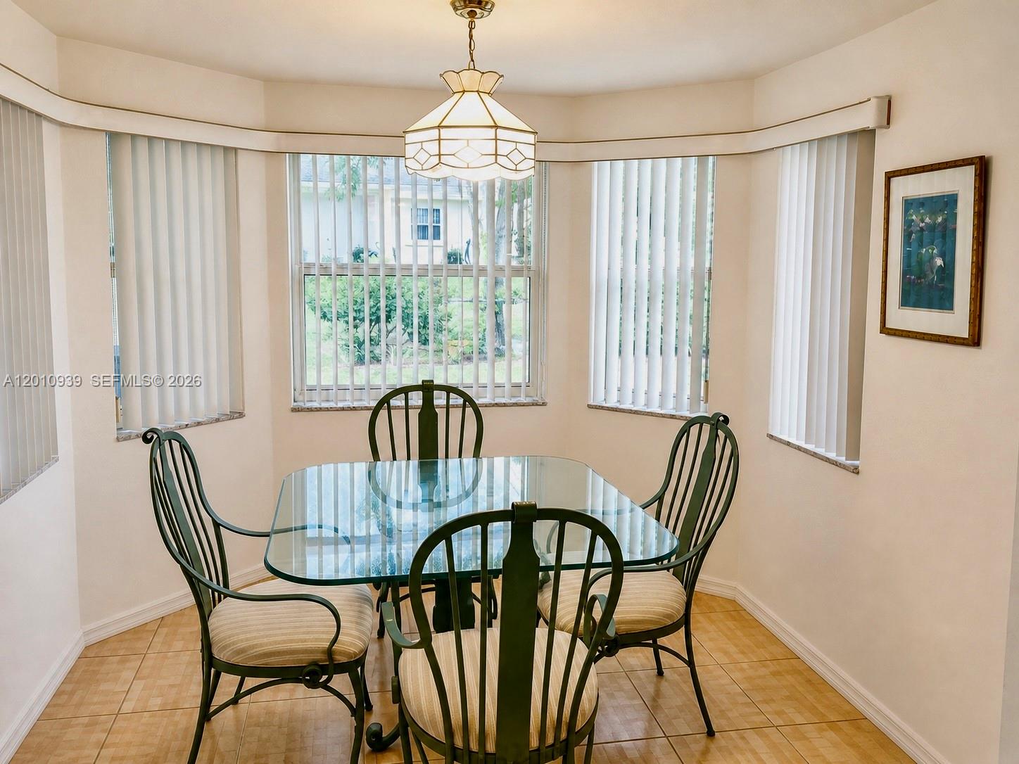 5880 Southwest 102nd Street Ocala, FL 34476 - Photo 15 of 17 a view of a dining room with furniture window and outside view