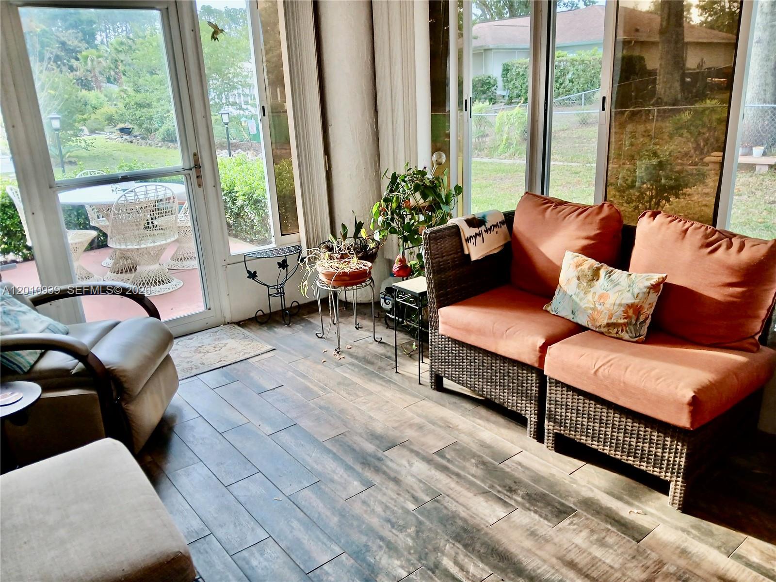 5880 Southwest 102nd Street Ocala, FL 34476 - Photo 16 of 17 a living room with furniture and a large window