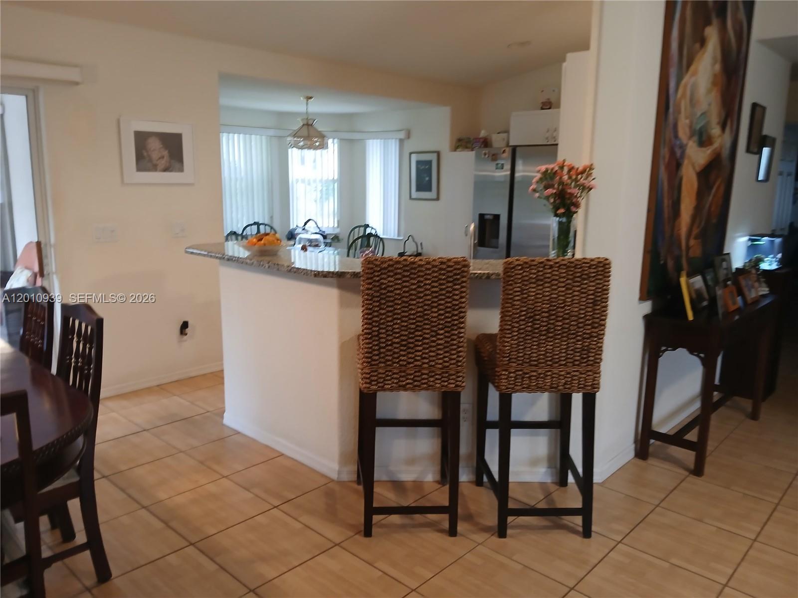5880 Southwest 102nd Street Ocala, FL 34476 - Photo 5 of 17 a dining room with furniture and window