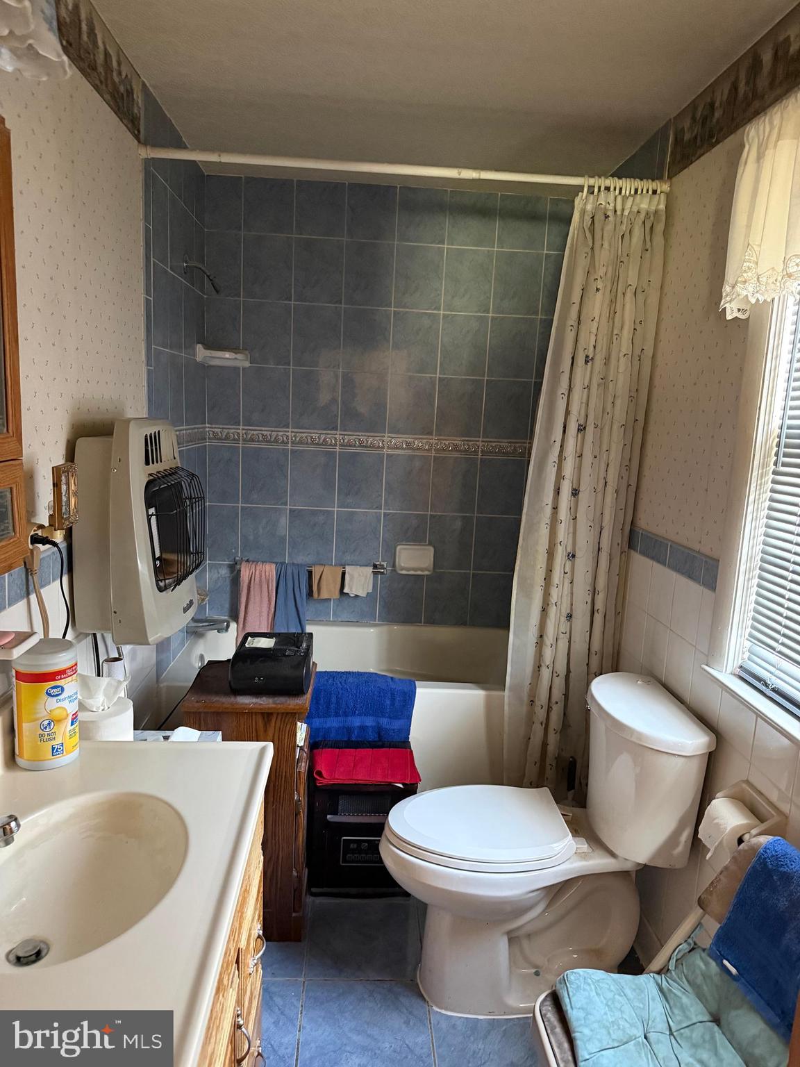 3467 Poor House Road Martinsburg, WV 25403 - Photo 14 of 23 a white toilet sitting next to a bathroom sink