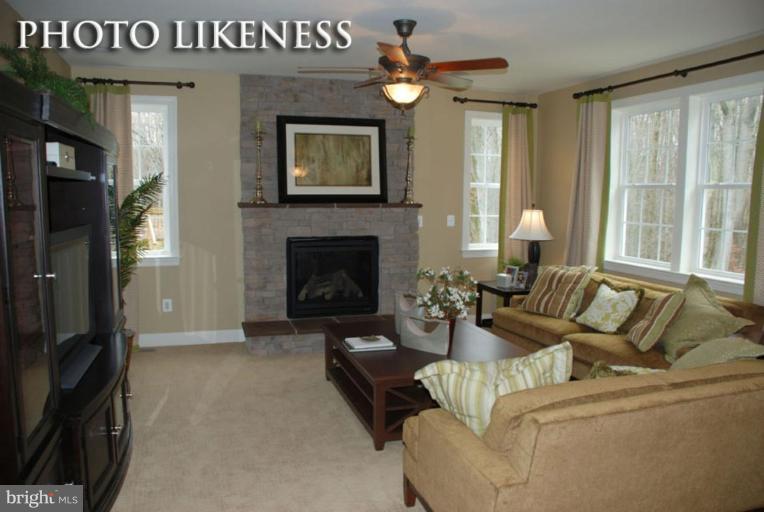 4233 Forge Road Perry Hall, MD 21128 - Photo 12 of 28 a living room with furniture and a fireplace