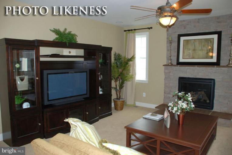 4233 Forge Road Perry Hall, MD 21128 - Photo 13 of 28 a living room with furniture and a fireplace