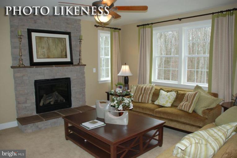 4233 Forge Road Perry Hall, MD 21128 - Photo 14 of 28 a living room with furniture and a fireplace