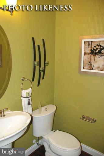 4233 Forge Road Perry Hall, MD 21128 - Photo 17 of 28 a white toilet sitting next to a bathroom sink