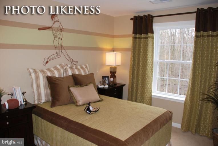 4233 Forge Road Perry Hall, MD 21128 - Photo 20 of 28 a bed sitting in a bedroom next to a window