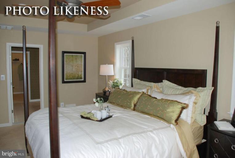 4233 Forge Road Perry Hall, MD 21128 - Photo 24 of 28 a bedroom with a bed and flowerpot