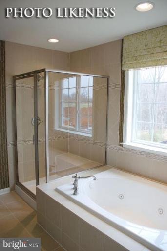 4233 Forge Road Perry Hall, MD 21128 - Photo 25 of 28 a bathroom with a bathtub and a sink