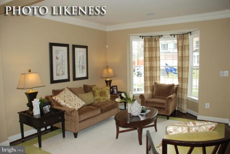 4233 Forge Road Perry Hall, MD 21128 - Photo 4 of 28 a living room with furniture and a lamp