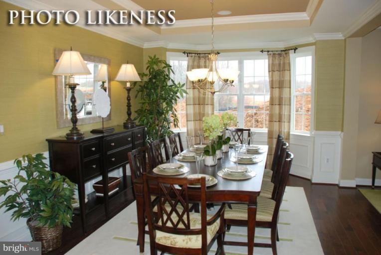 4233 Forge Road Perry Hall, MD 21128 - Photo 6 of 28 a view of a dining room with furniture and chandelier
