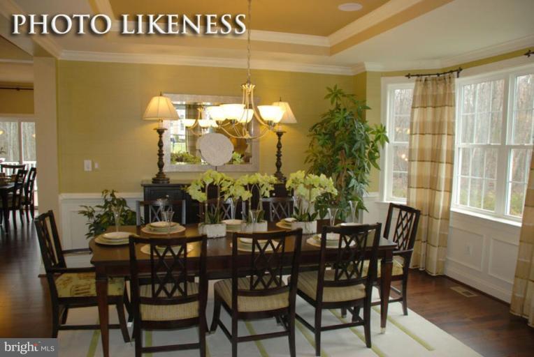 4233 Forge Road Perry Hall, MD 21128 - Photo 7 of 28 a view of a dining room with furniture and wooden floor
