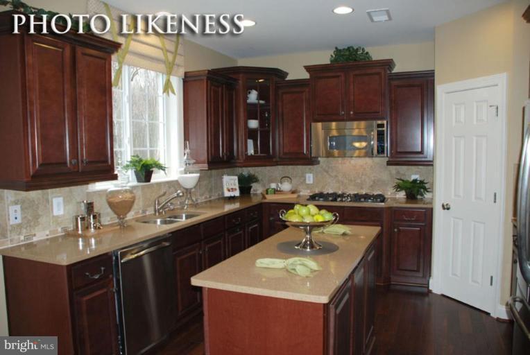 4233 Forge Road Perry Hall, MD 21128 - Photo 9 of 28 a kitchen with a sink cabinets and wooden floor