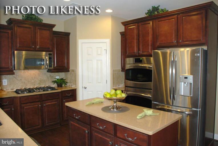 4233 Forge Road Perry Hall, MD 21128 - Photo 10 of 28 a kitchen with a sink and a refrigerator