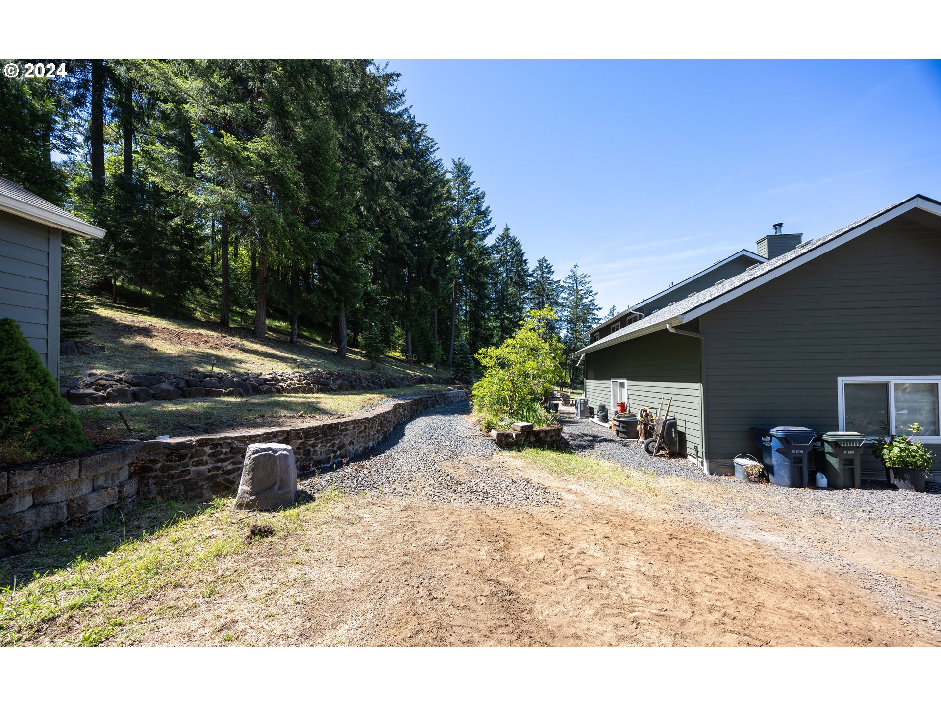 37232 Wallace Creek Road Springfield, OR 97478 - Photo 36 of 45 a view of a backyard with plants and a patio