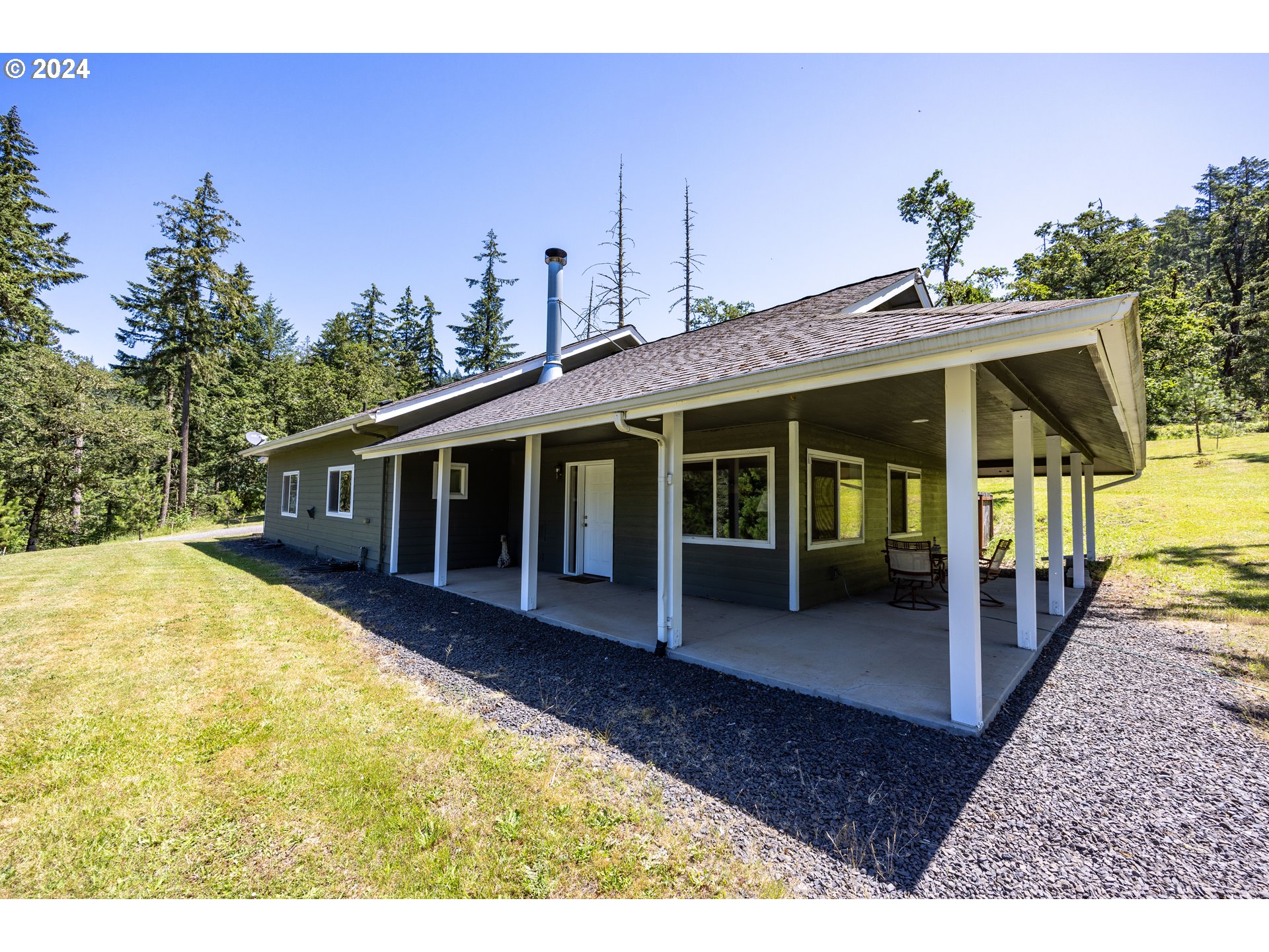 37232 Wallace Creek Road Springfield, OR 97478 - Photo 4 of 45 a view of a house with backyard porch and sitting area