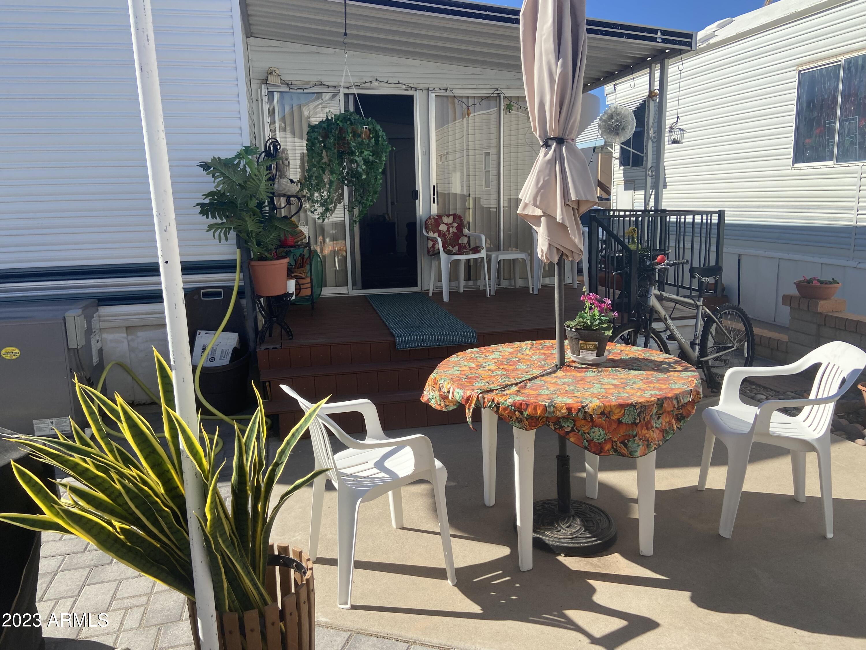 a view of a dinning tables and chair in the patio