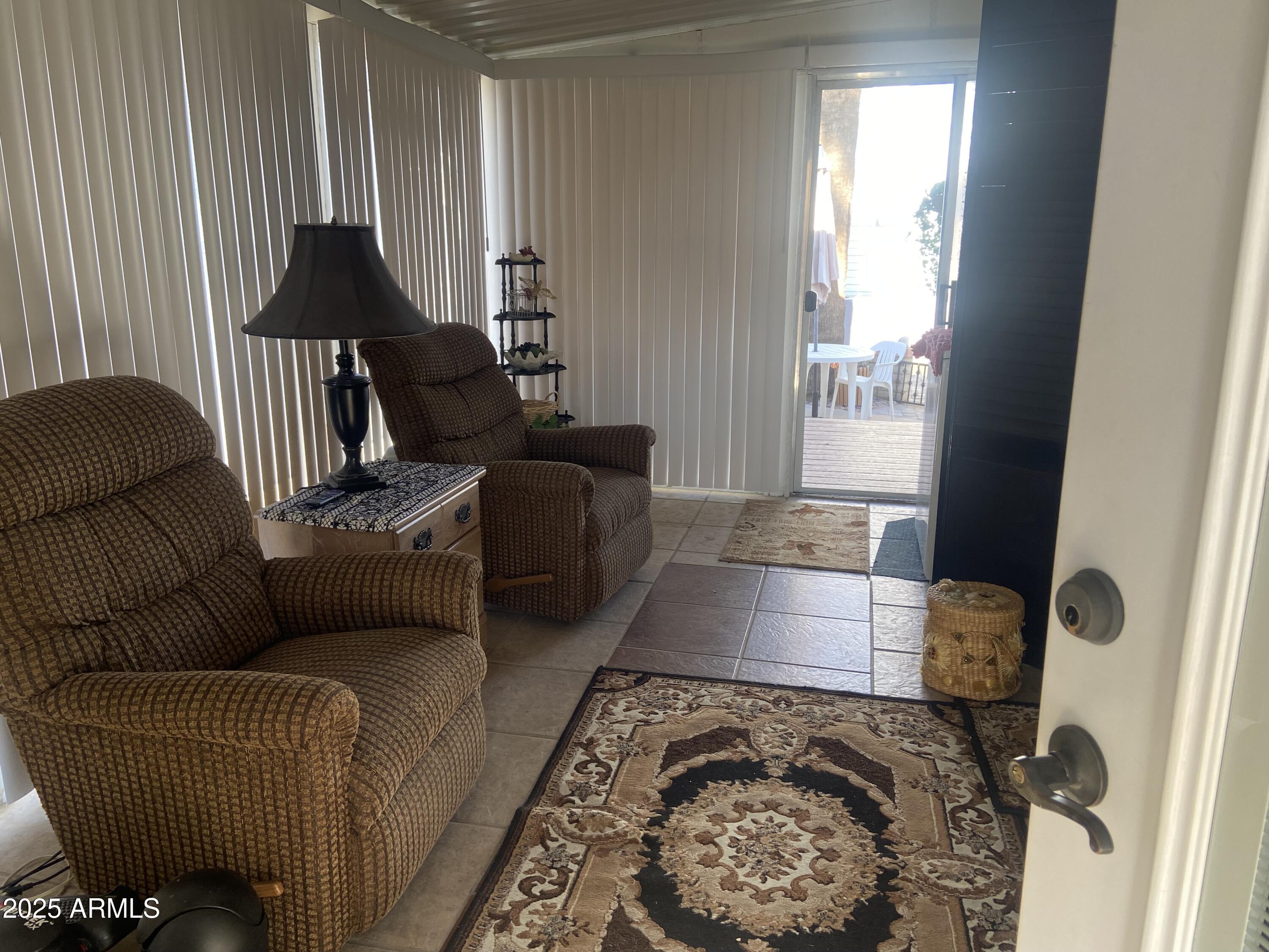 3301 South Goldfield Road Apache Junction, AZ 85119 - Photo 17 of 45 a living room with furniture and a window