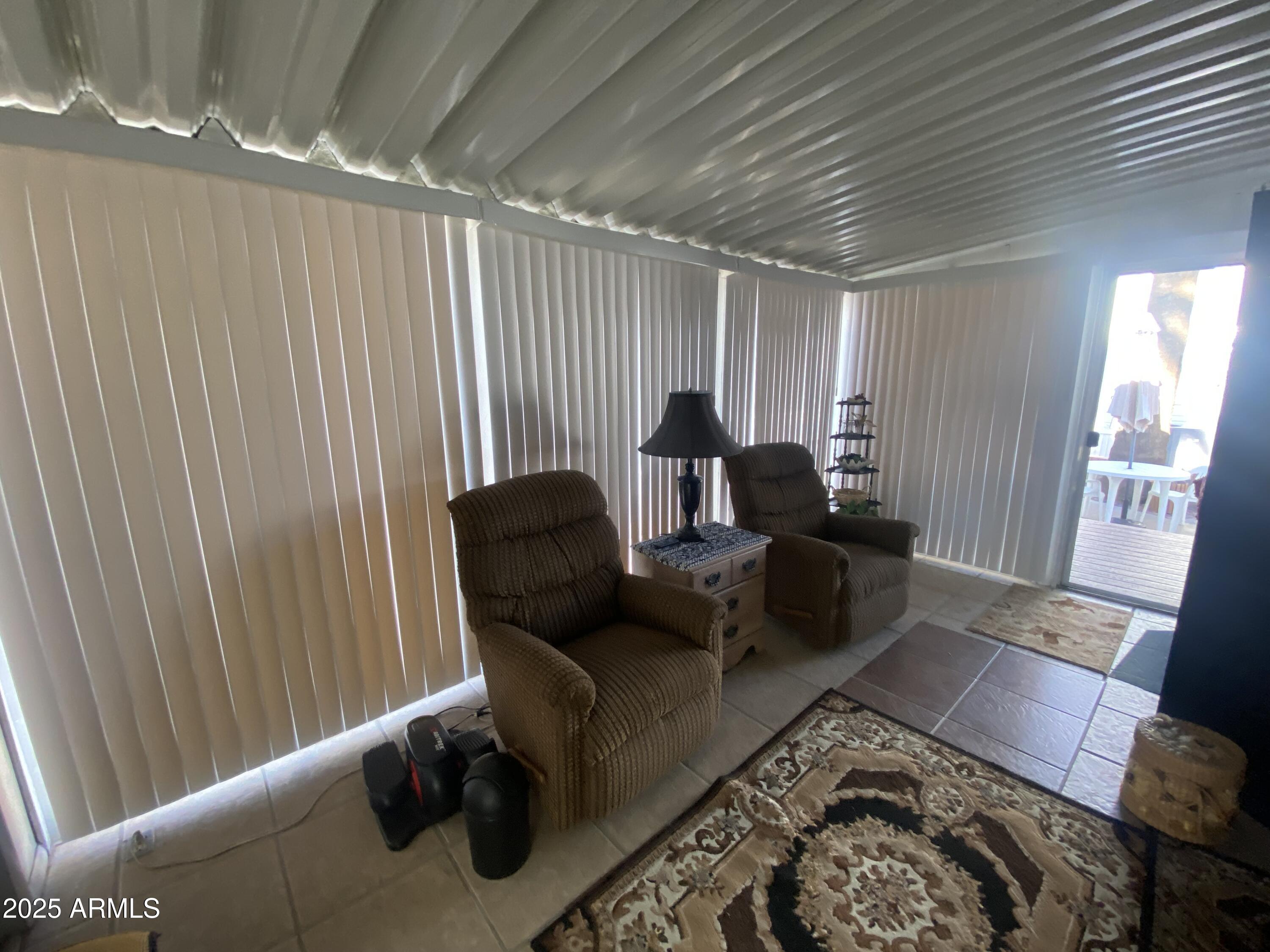 3301 South Goldfield Road Apache Junction, AZ 85119 - Photo 20 of 45 a living room with furniture and a large window
