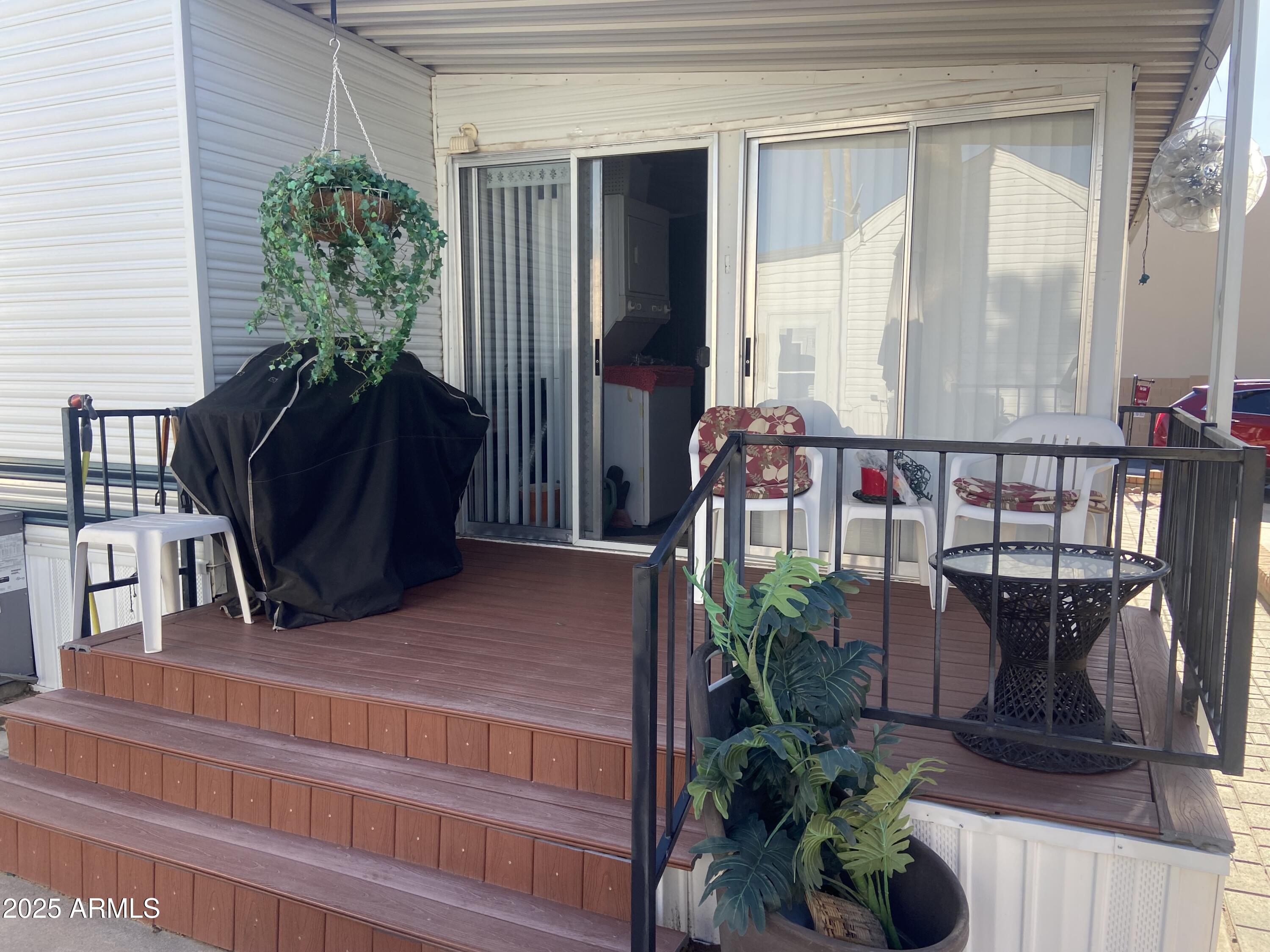 3301 South Goldfield Road Apache Junction, AZ 85119 - Photo 35 of 45 a view of balcony with furniture and potted plants