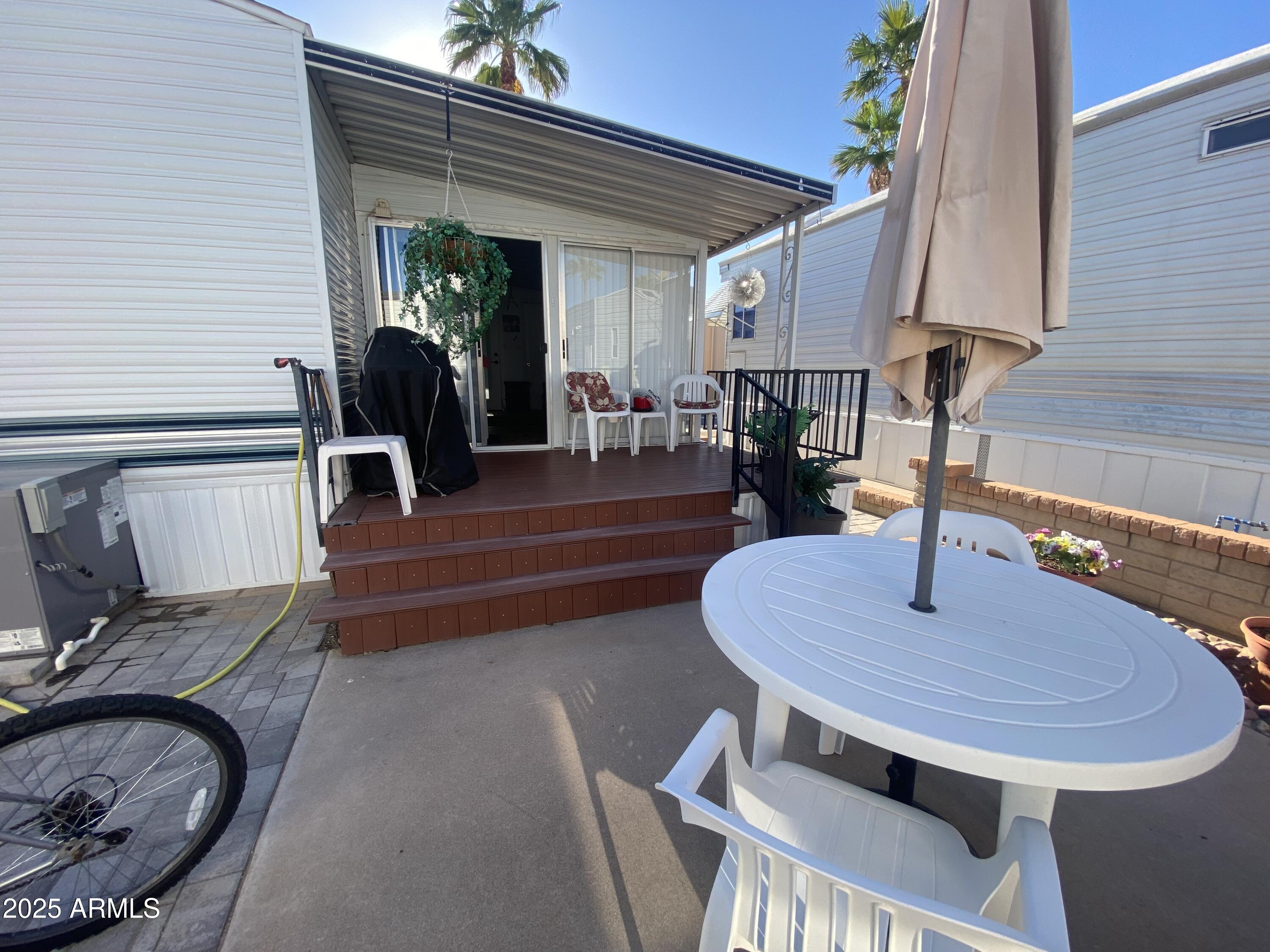 3301 South Goldfield Road Apache Junction, AZ 85119 - Photo 43 of 45 a dining room with furniture and wooden floor