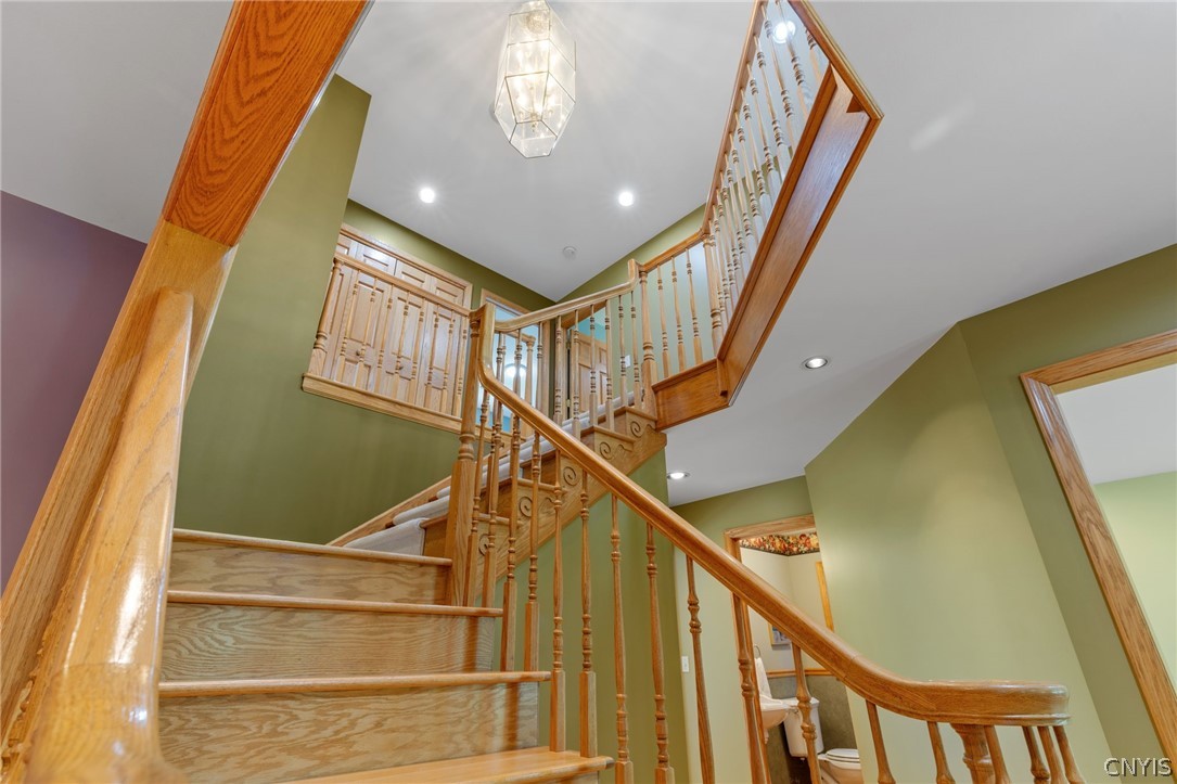 1103 Rail Fence Road Camillus, NY 13031 - Photo 10 of 50 The stunning dual-sided custom oak staircase makes an unforgettable first impression and is a true statement piece. The sellers' pride of ownership and the quality truly sets this home apart from others.