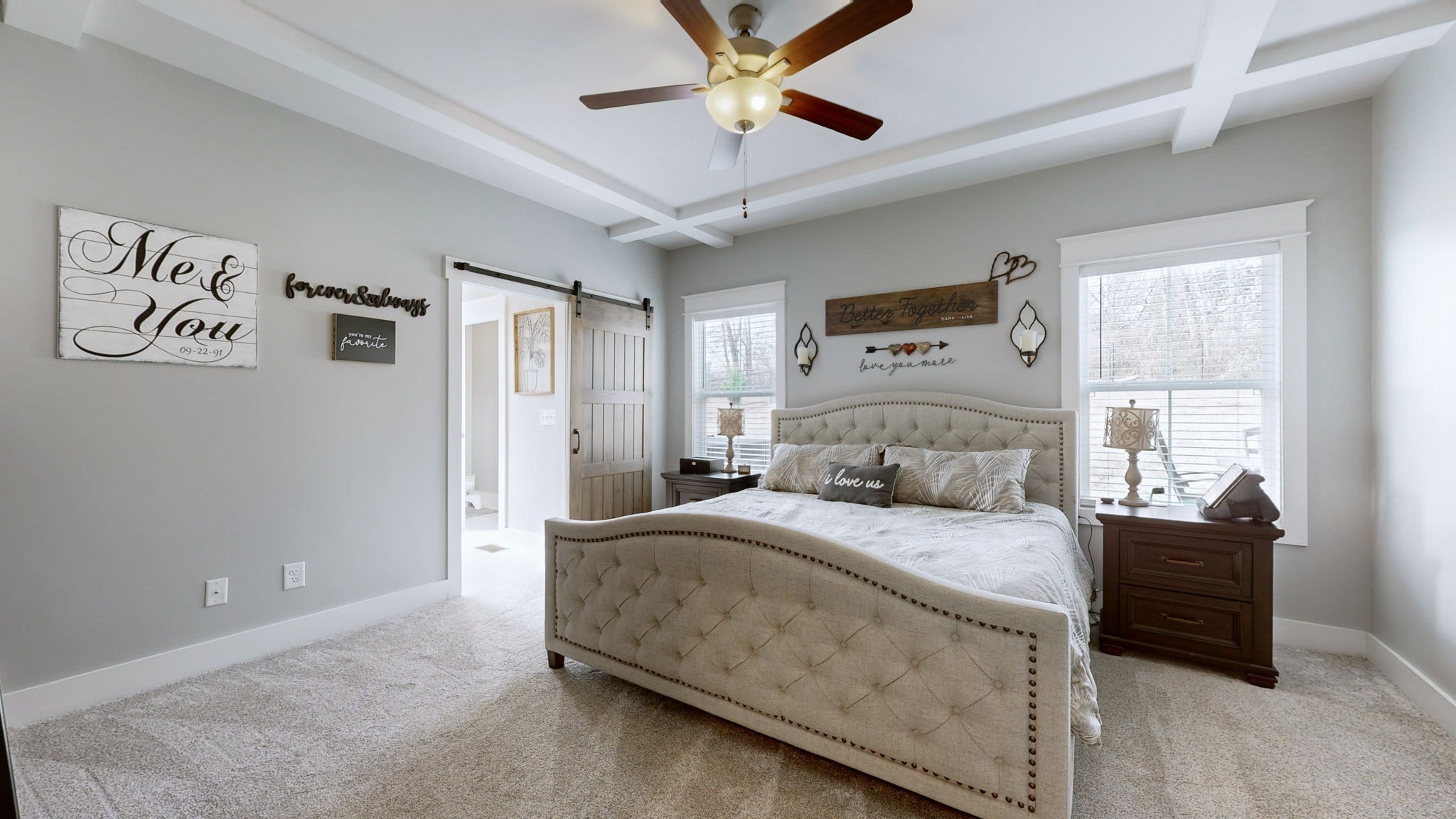 147 Enoch Way Gallatin, TN 37066 - Photo 15 of 60 a bedroom with a bed and a chandelier