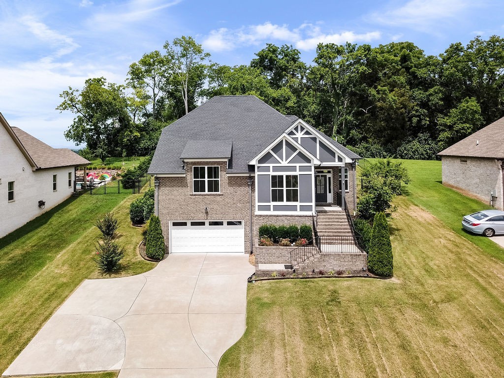 147 Enoch Way Gallatin, TN 37066 - Photo 2 of 60 a front view of a house with a yard