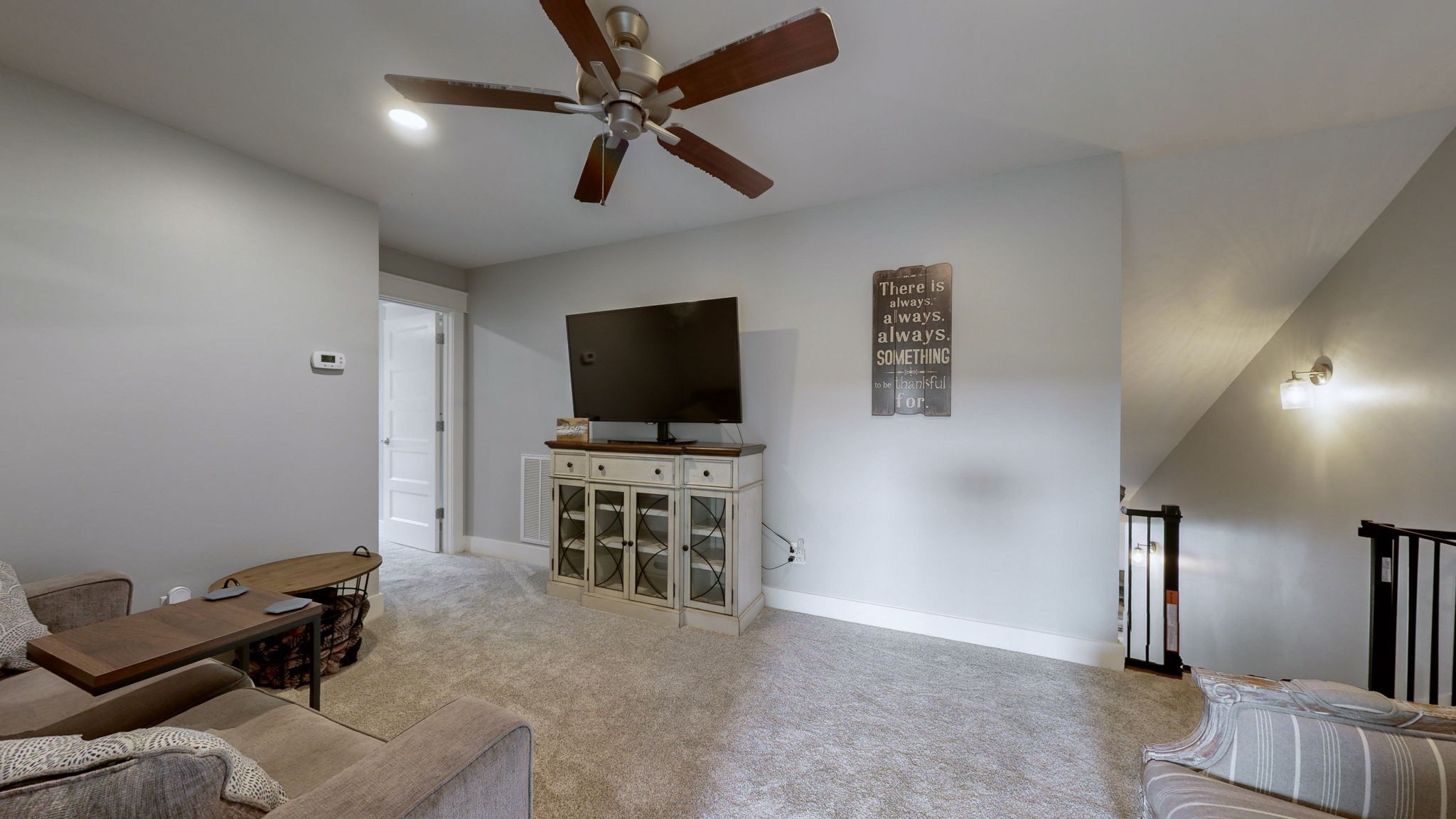 147 Enoch Way Gallatin, TN 37066 - Photo 29 of 60 a view of a livingroom with furniture and a flat screen tv
