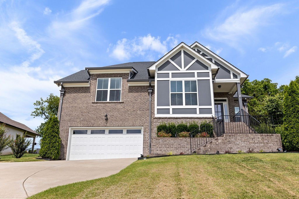 147 Enoch Way Gallatin, TN 37066 - Photo 3 of 60 a front view of a house with a yard