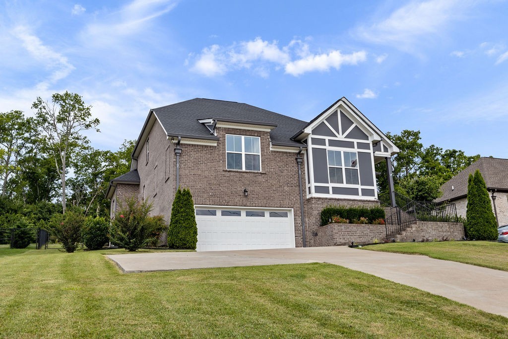 147 Enoch Way Gallatin, TN 37066 - Photo 40 of 60 a front view of a house with a yard
