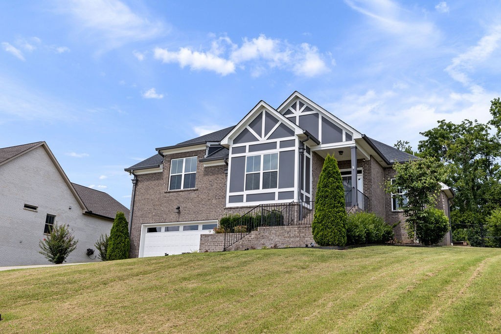 147 Enoch Way Gallatin, TN 37066 - Photo 41 of 60 a front view of a house with a garden