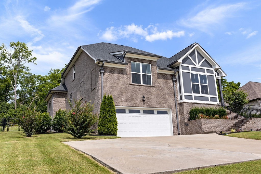 147 Enoch Way Gallatin, TN 37066 - Photo 42 of 60 a front view of a house with a yard